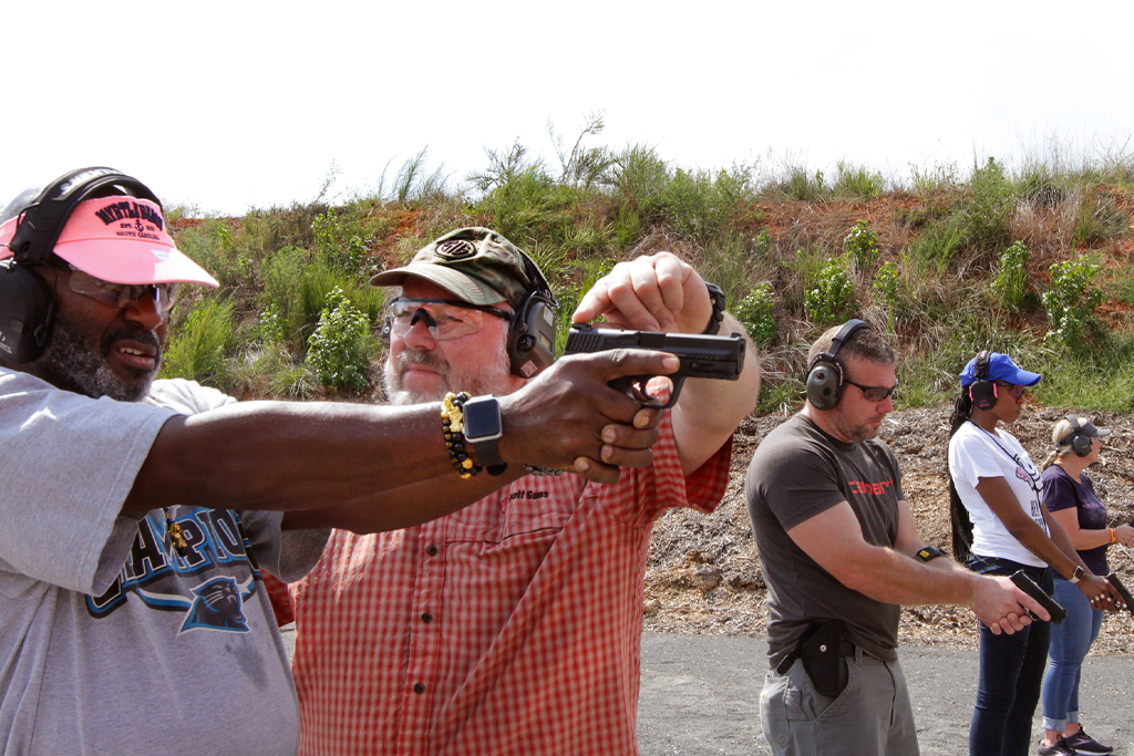 Sam Cranston teaches gun safety at Hyatt Farms Shooting Complex.
